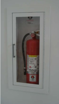 Fire extinguisher in housing in wall